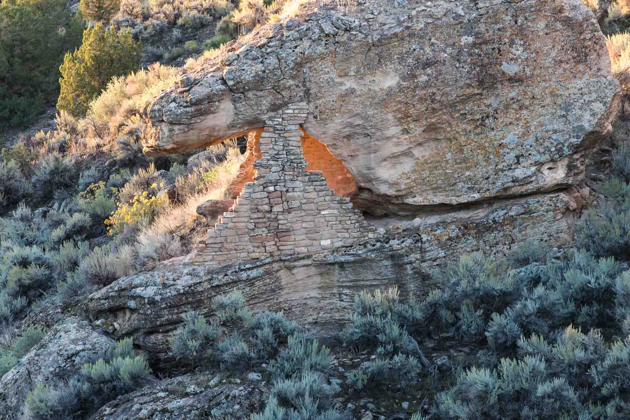 A view of Eroded Boulder House backlit by the rising sun showing a touch pareidolia, Hovenweep National Monument, Aneth UT, October 1, 2016
